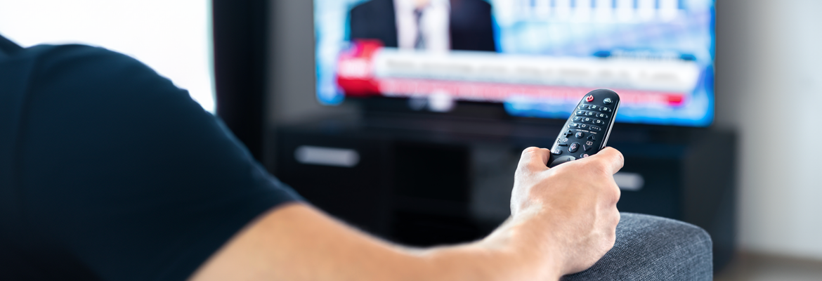Man watching the news on television