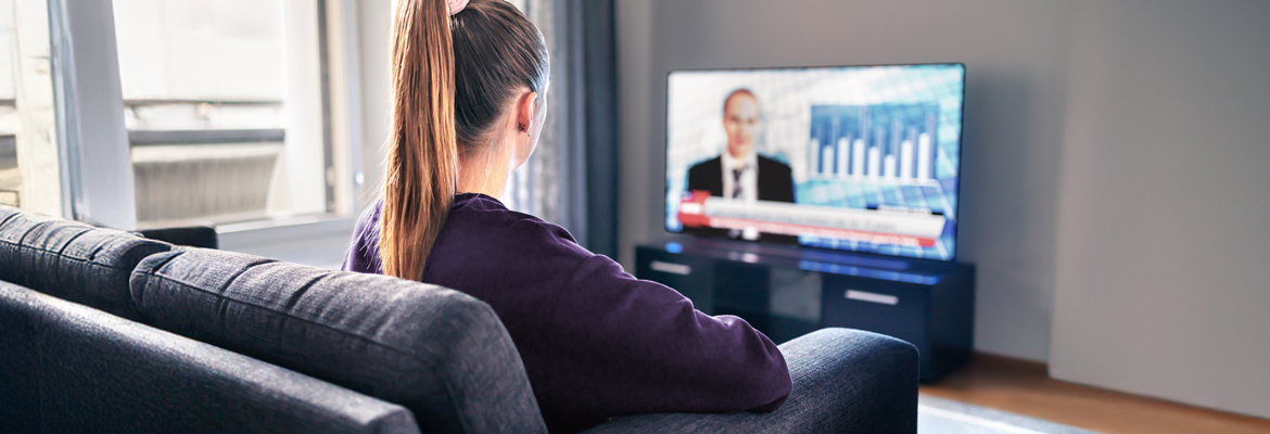 Woman watching the news on TV